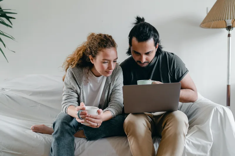 Couple managing credit card debt payoff with Bright Money automation